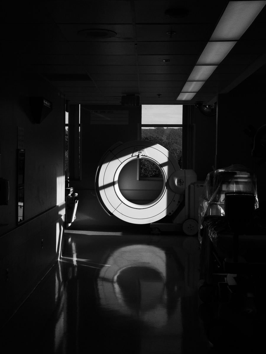 A scanner at the end of a hospital corridor