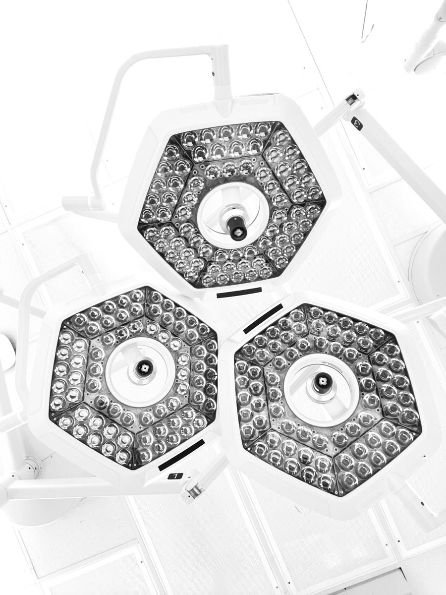 Three theatre lights seen from below